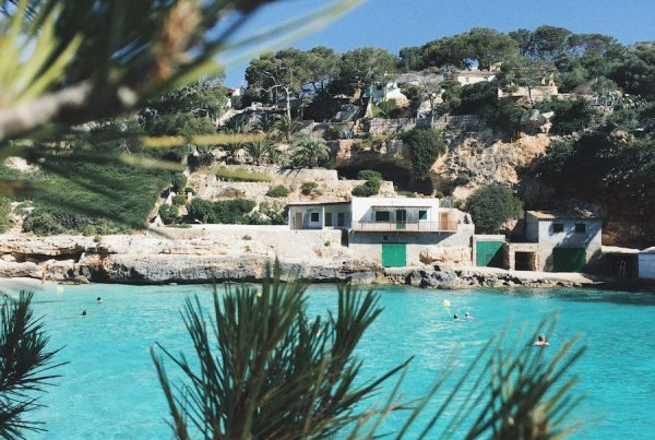 selective focus photography of concrete house near blue water